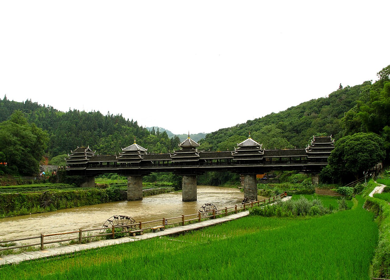 A wooden bridge over the river in Guangxi